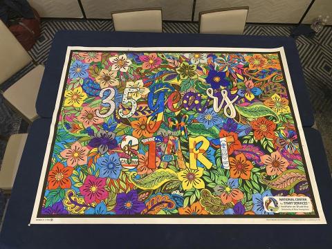 A poster saying 35 years of START that was provided by sponsor Debbie Lynn and colored in by event participants